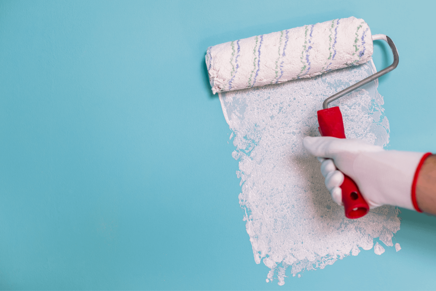 pamela-sandall-design-los-angeles-ca-should-you-renovate-before-listing-white-paint-roller-painting-over-blue-wall